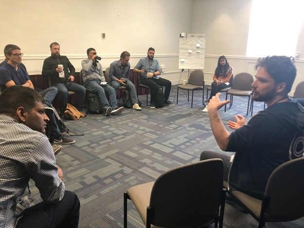 Timescale team and devopsdays attendees in discussion 